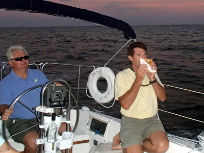 Captain Ed Blowing Conch Horn to honor Sunset